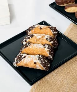 Tablecraft Professional Bakeware Tablecraft CW2116BK 7" X 6 1/2" X 3/8" Black Cast Aluminum Sixth Size Rectangular Cooling Platter